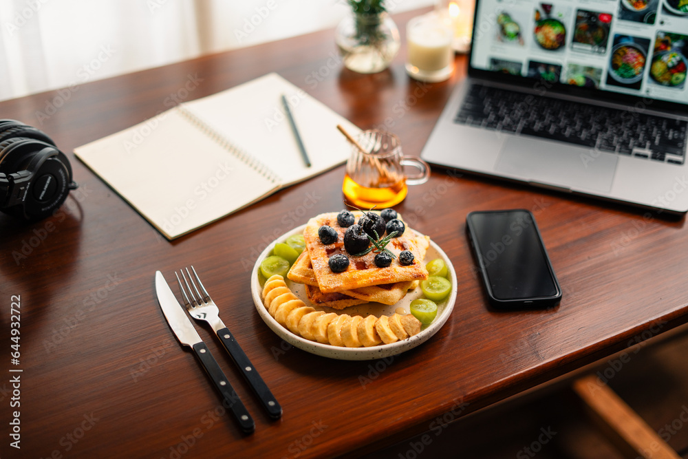 Waffles and mixed fruit on the desk