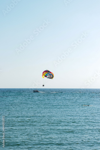 Colorful parachute with I LOVE CYPRUS text writing used for parasailing by boat off the Paphos harbour and port coast photo