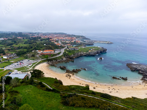 Aerial view on Playa de Toro in Llanes, Green coast of Asturias, North Spain with sandy beaches, cliffs, hidden caves, green fields and mountains. © barmalini