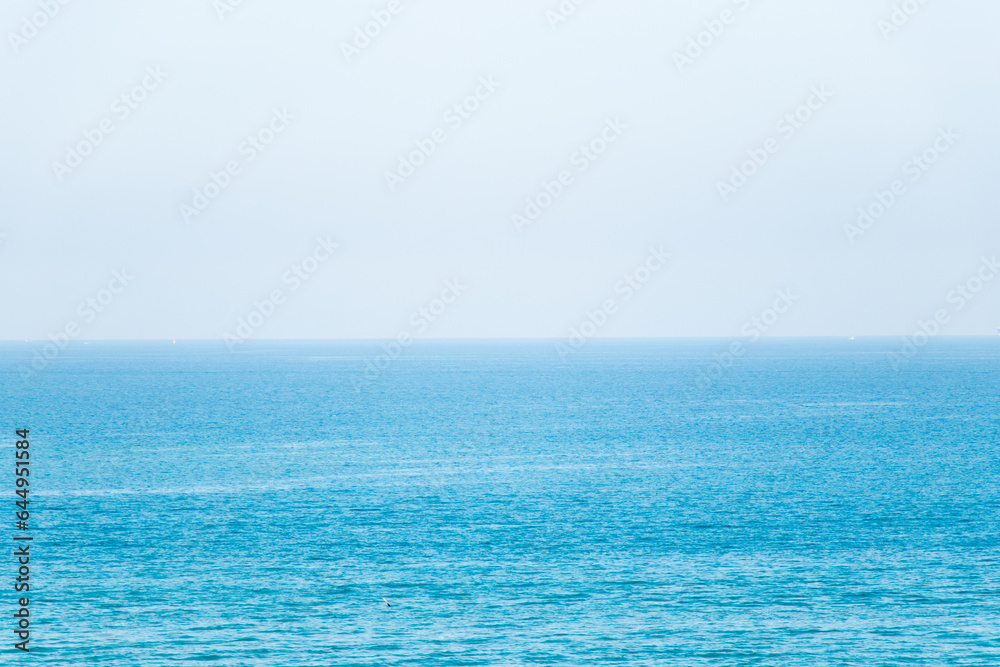 Blue color of sea with the clear sky background