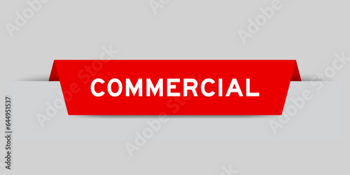 Red color inserted label with word commercial on gray background
