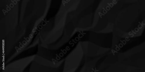 Crumpled paper texture dark black crumpled paper texture crush paper so that it becomes creased and wrinkled. Old black crumpled paper sheet background texture.	
