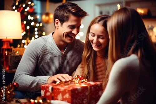 Lovely family opening their gifts. They enjoy the warm Christmas atmosphere. AI Generated