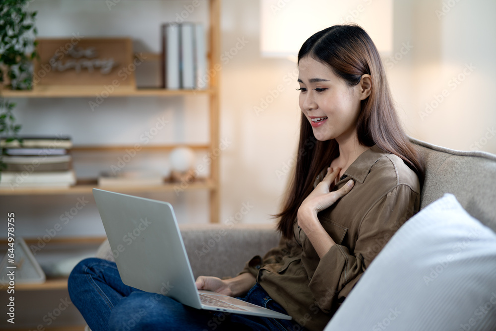 young woman sitting using laptop communicating with colleagues young woman sitting using laptop communicating with colleagues