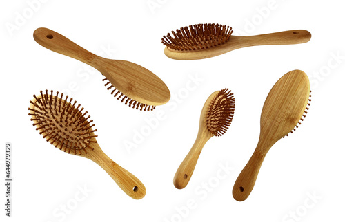 Wooden hairbrushes set isolated object bamboo material eco-friendly natural concept, cutout personal woman beauty accessory, soft focus clipping path © Contes de fée 