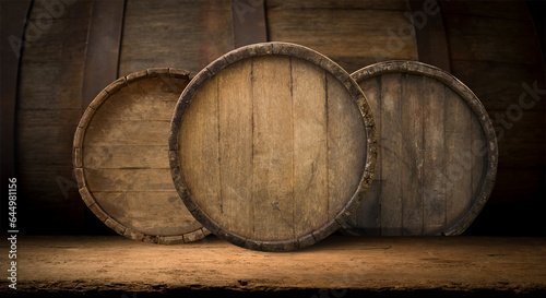 Oktoberfest beer barrel and beer glasses with wheat and hops on wooden table. High quality photo