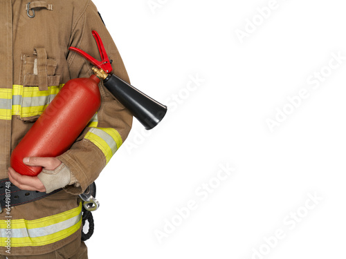 Unrecognizable male firefighter in uniform holding red extinguisher. Crop view of man in fireman workwear carrying fire extinguisher, isolated on white background, copy space. Concept of safety, work.