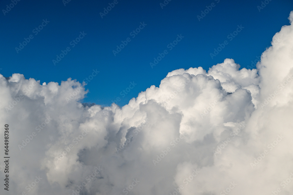 Beautiful Fluffy White and Gray Cumulonimbus Clouds on Blue Sky Beautiful Fluffy White and Gray Cumulonimbus Clouds on Blue Sky