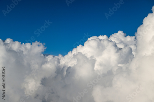 Beautiful Fluffy White and Gray Cumulonimbus Clouds on Blue Sky