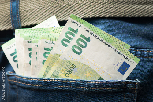 100 euro banknotes in a trouser pocket. Money in the back pocket.