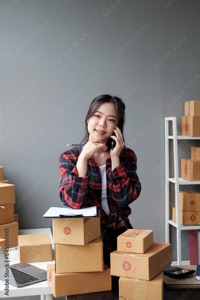 Asian small business owner working at home office. Business retail market and online sell marketing delivery, SME e-commerce concept. Asian small business owner working at home office. Business retail market and online sell marketing delivery, SME e-commerce concept.
