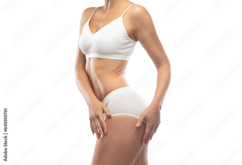 A slender swarthy woman in white underwear on a white background. Healthy lifestyle, sport and diet.