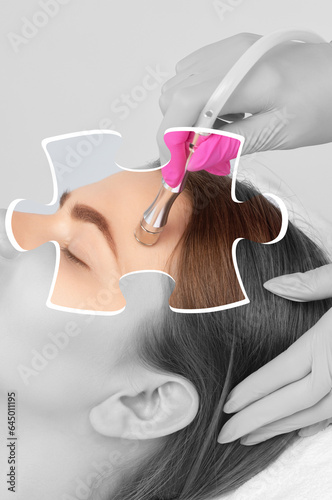 The cosmetologist makes the procedure Microdermabrasion of the face skin of a beautiful girl in a beauty salon.Cosmetology and professional skin care.