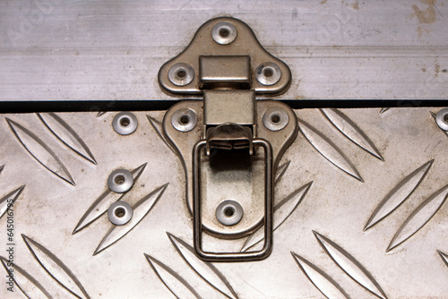 Open iron lock of an iron suitcase.
