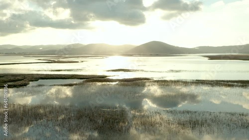 Aerial Orbit Shot of Lake Cerknica, Largest intermittent lake in Europe At Epic Morning Sunrise.