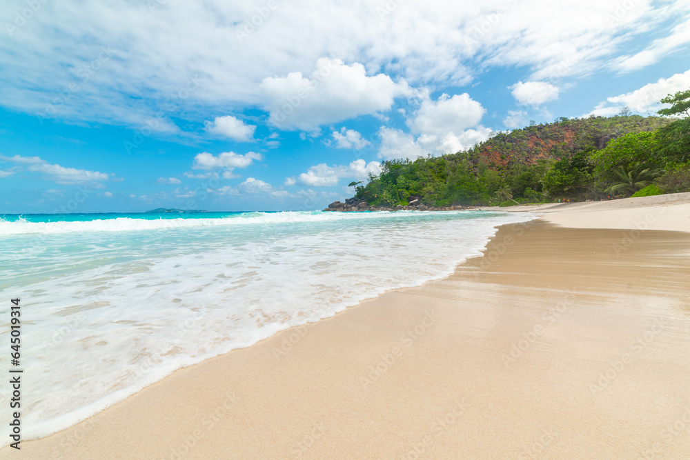 Cloudy sky over Anse Georgette beach