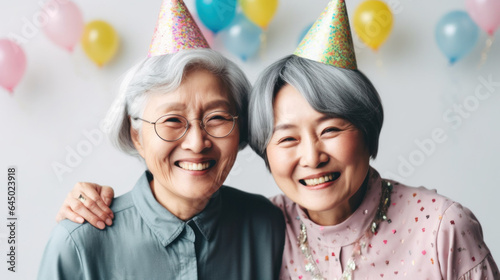 Senior women celebrating a birthday in a studio portrait. Generative AI
