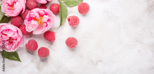 An exquisite scene featuring peonies and raspberries, combining floral elegance with fruity freshness. This image is perfect for culinary, dessert, or floral-themed projects.