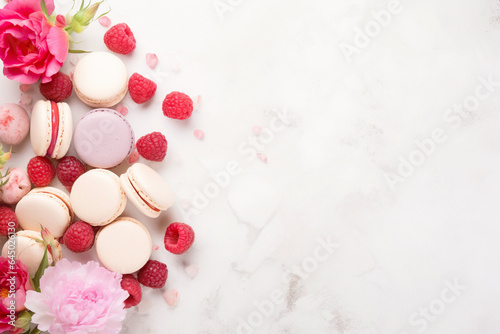 A delightful scene featuring delicious raspberry macaroons and peonies, combining sweet treats with floral elegance.Perfect for culinary or dessert-themed projects.