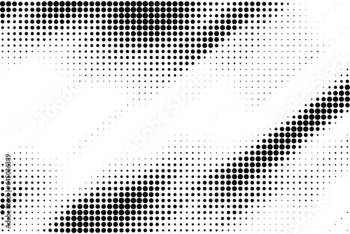 Abstract halftone dotted background. Grunge effect vector texture