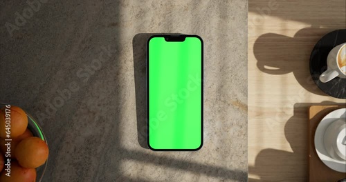 Smartphone place on kitchen table, Green screen telephone, Close up display mobile phone with mock up, Chroma key monitor