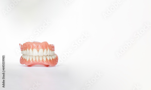Dentures over white background with copy space. Dental plan. Dentistry prosthesis. Dental Health