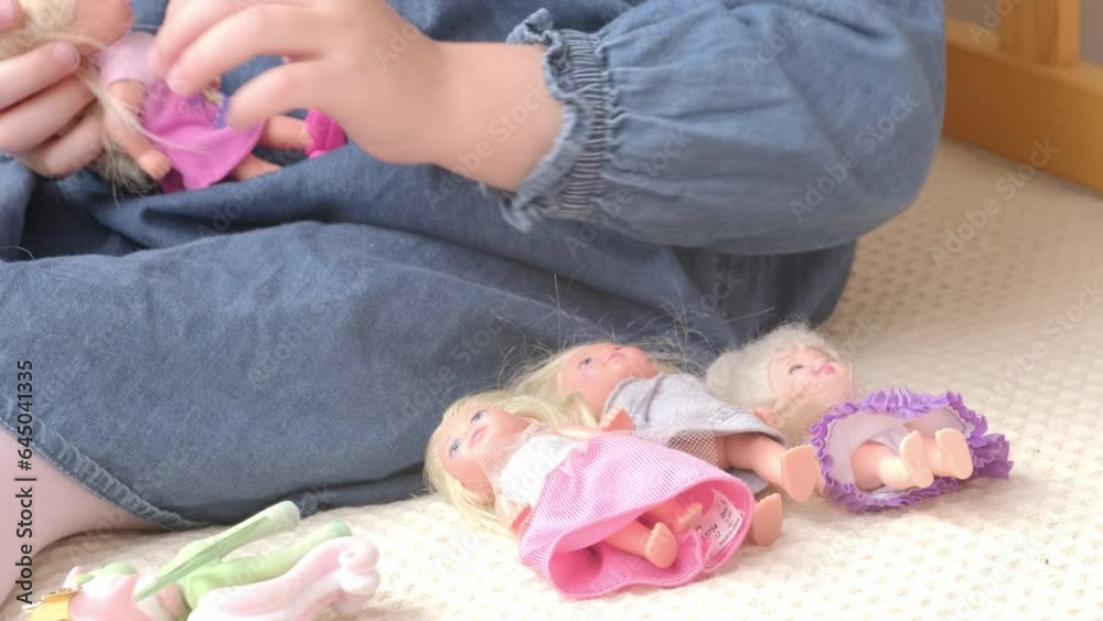 mother-daughter doll play can reflect cultural norms and traditions, offering insights into societal values, close-up of children's hands with toys, therapeutic activities mother-daughter doll play can reflect cultural norms and traditions, offering insights into societal values, close-up of children's hands with toys, therapeutic activities