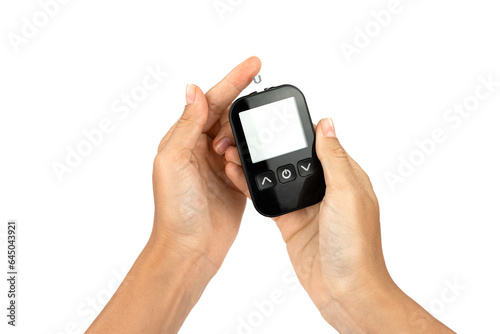 World Diabetes Day November 14, there is an electronic test strip for measuring glucose levels in the blood and body in young woman hands, the isolation on a white background, a device for home use