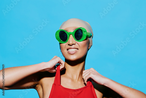 Woman studio trendy swimsuit happy smile hat fashion portrait beauty sunglasses summer fun person
