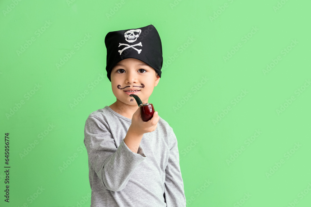Cute little pirate with smoking pipe on green background Cute little pirate with smoking pipe on green background