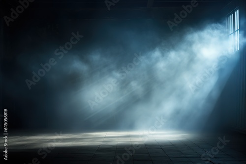 Vászonkép Dark, empty prison cell with rays of light in the smoke and a spot of light on the floor