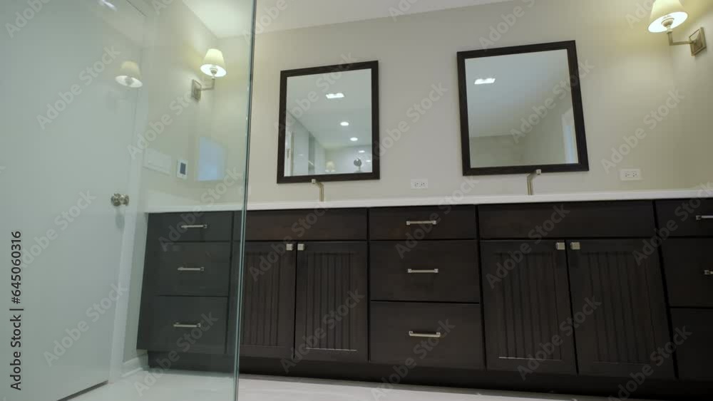 Modern Tiled Bathroom with Shower in home, real estate interior. Wide Move camera footage Modern Tiled Bathroom with Shower in home, real estate interior. Wide Move camera footage