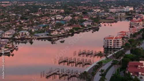 Aerial shot of the bay and buildings in the city of Naples, Florida on sunset time photo