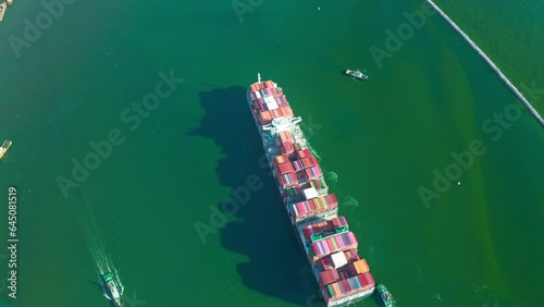 4K resolution high angle view of a container ship sailing at the sea for transportation.