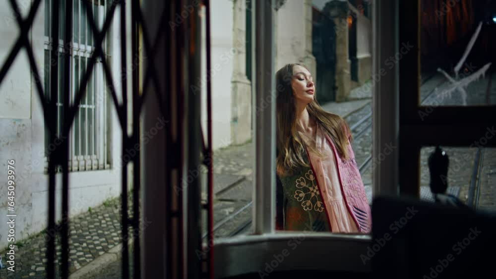 Confident woman posing urban cozy street. Girl standing on empty evening city Confident woman posing urban cozy street. Girl standing on empty evening city