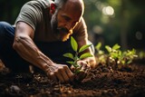 Environmentalist planting a sapling