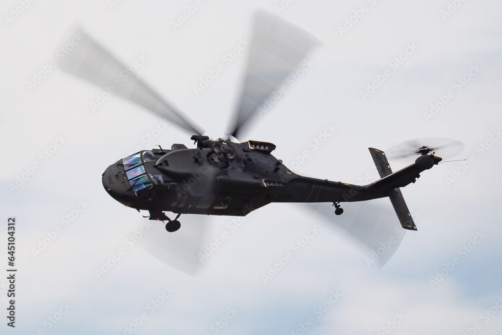 Untitled military helicopter at air base. Air force and army flight transportation. Aviation and rotorcraft. Transport and airlift. Military industry.
