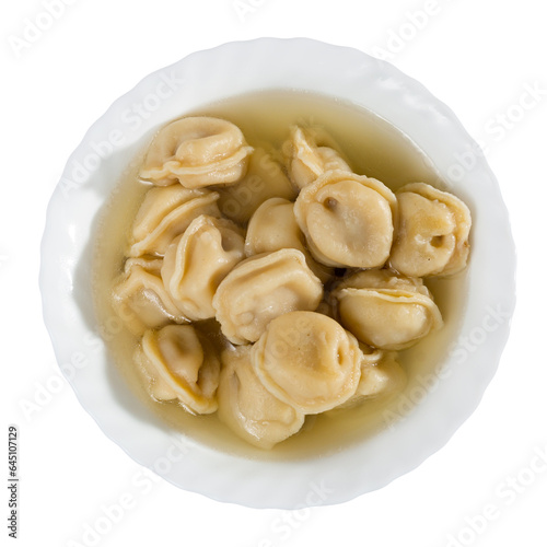 Appetizing meat dumplings with broth served on plate. Isolated over white background