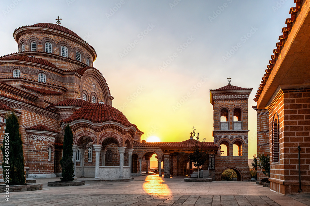 Monastery of Dormition of Holy Mary (Panagia Evrou) Orthodox Monastery, Makri Evros Greece, catholic church in Byzantine style, sunset colors - obrazy, fototapety, plakaty 
