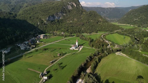 Aerial View Church in the countryside with Highway run pass by at Bohinjska Bistrica, Slovenia   photo