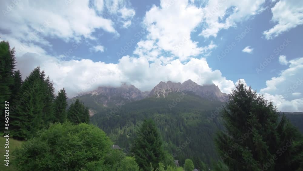 Beautiful mountains of rock covered by the white clouds of the blue sky with the Beautiful mountains of rock covered by the white clouds of the blue sky with the