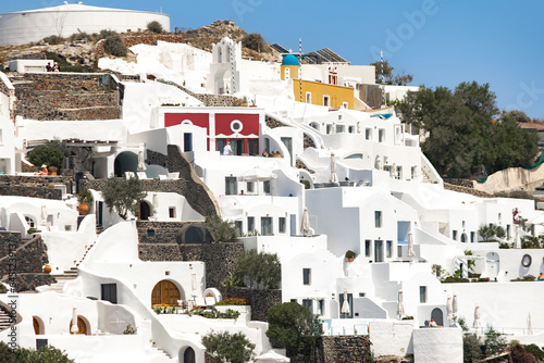 Santorini, Greece - 05 25 2023: A close up of Fira's (Thira) caldera traditional white architecture overlooking the sea. a Great couples' escape