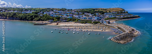 An aerial view from Cardigan Bay across the harbour and town at New Quay, Wales in summertime 