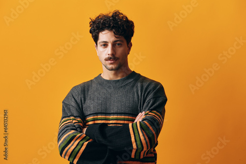 Fashion man male sweater posing portrait smile orange trendy winter student happy background isolated stylish
