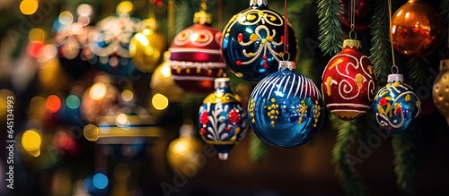 Colorful ornaments adorn a Christmas tree.