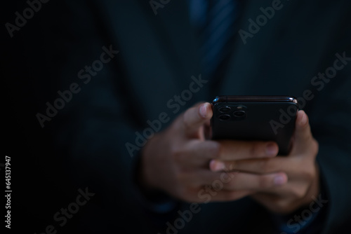 Business man holding a smart phone