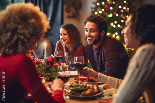 Family having Christmas dinner at home  gathered around the table  enjoying their time together