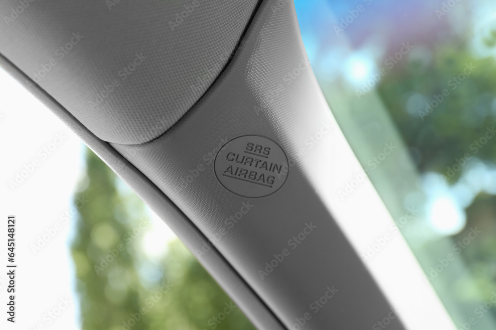 Safety airbag sign on pillar panel inside car Safety airbag sign on pillar panel inside car