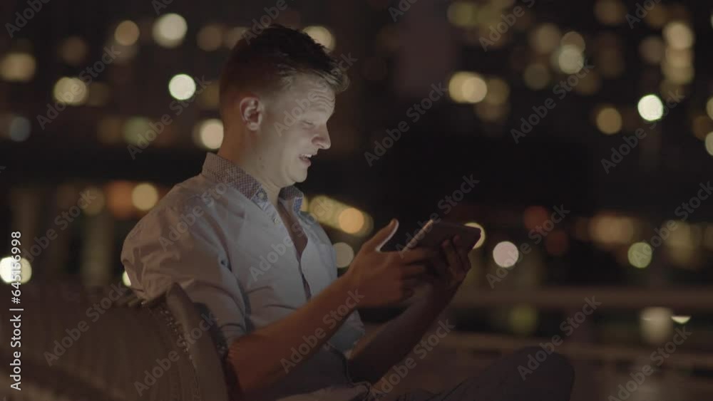 Young Man Having A Video Call on Mobile Tablet Screen Talking Young Man Having A Video Call on Mobile Tablet Screen Talking