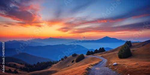 Incredible mountain landscape with a road in the foreground and blue mountains at dawn. AI Generation 